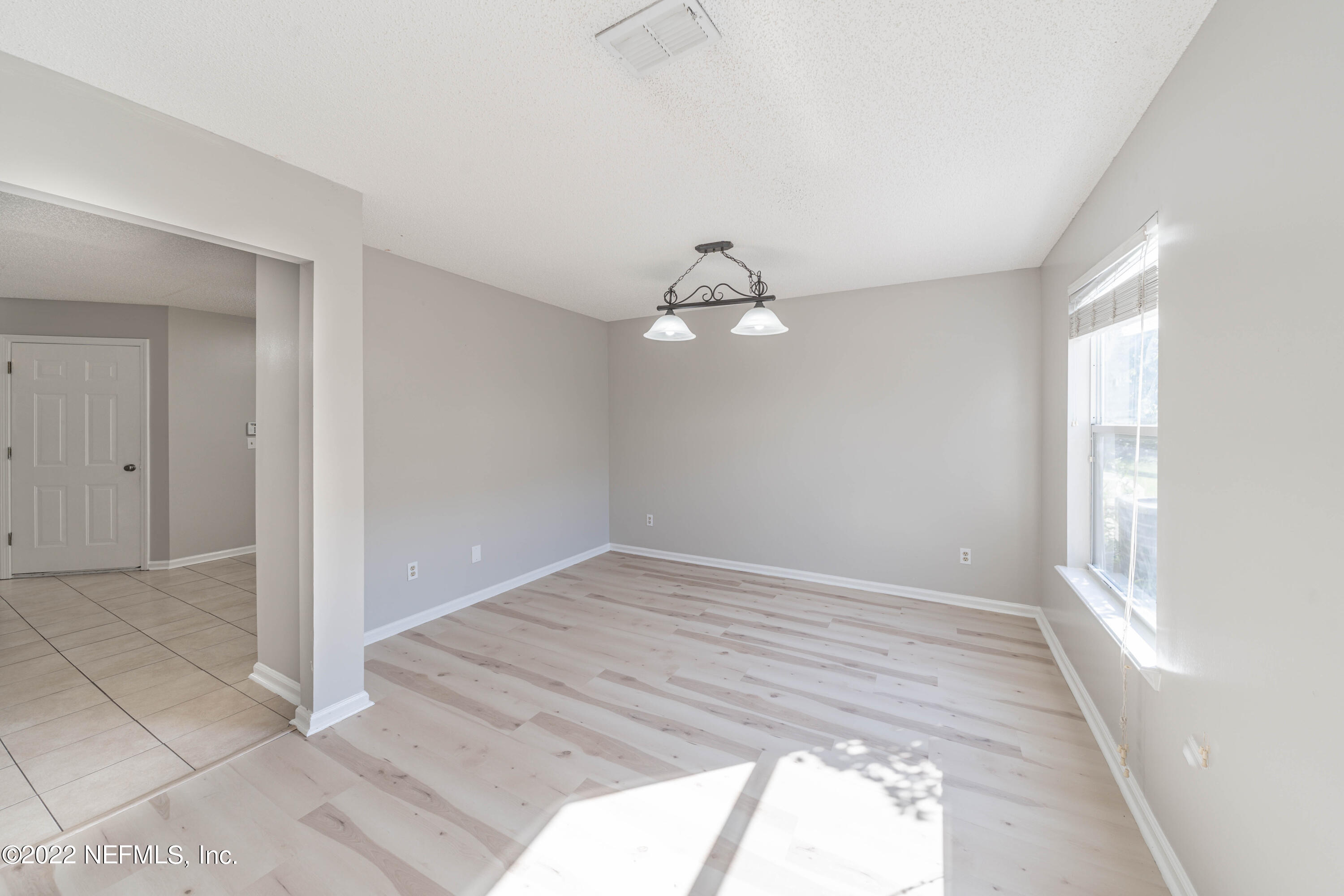 500 South Steel Bridge Road, Unit 3 St. Johns, FL 32259 - Photo 9 of 43 wooden floor in an empty room with a window