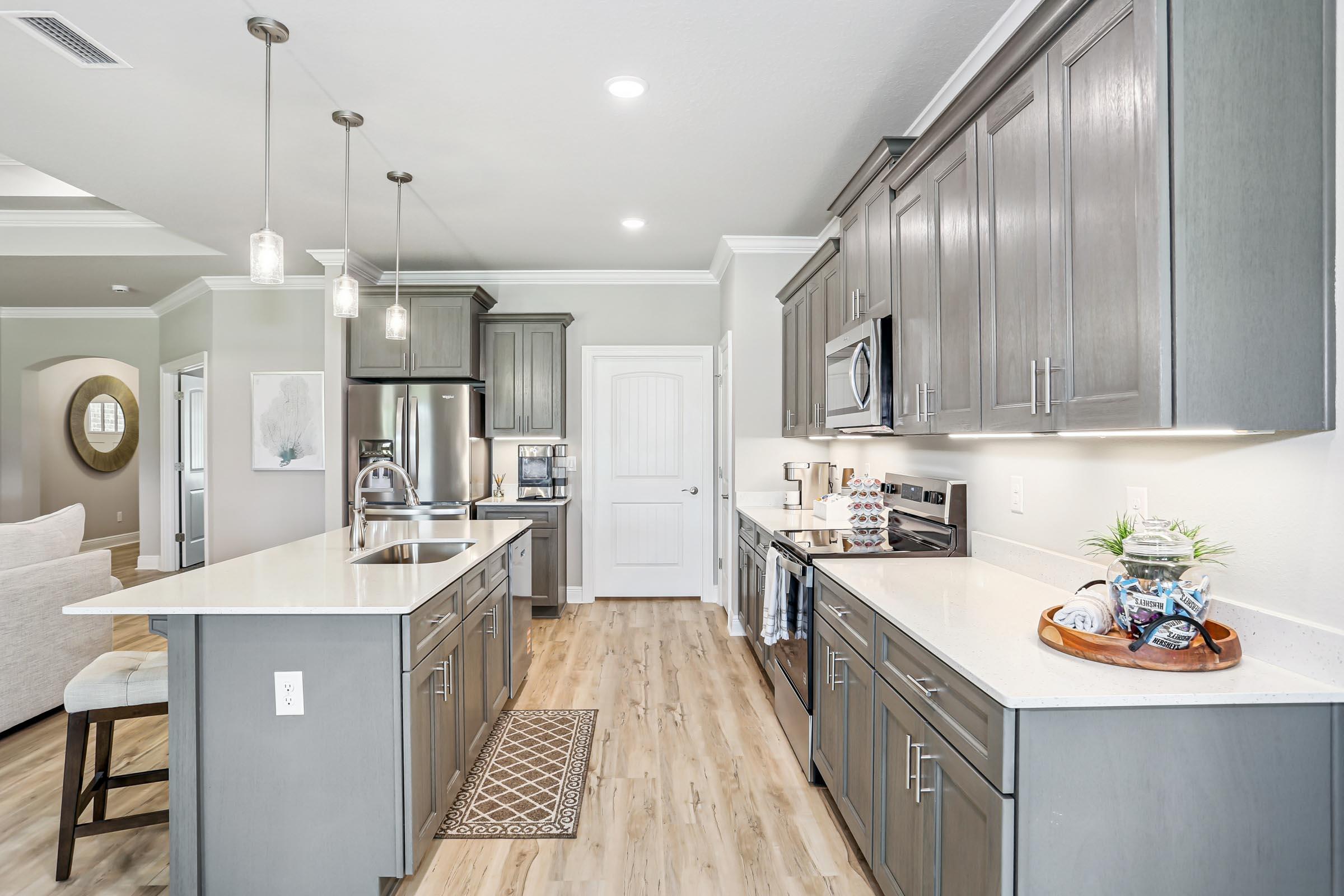 4863 Horace Lunsford Road Milton, FL 32570 - Photo 12 of 36 a kitchen with stainless steel appliances granite countertop a sink a stove and a refrigerator