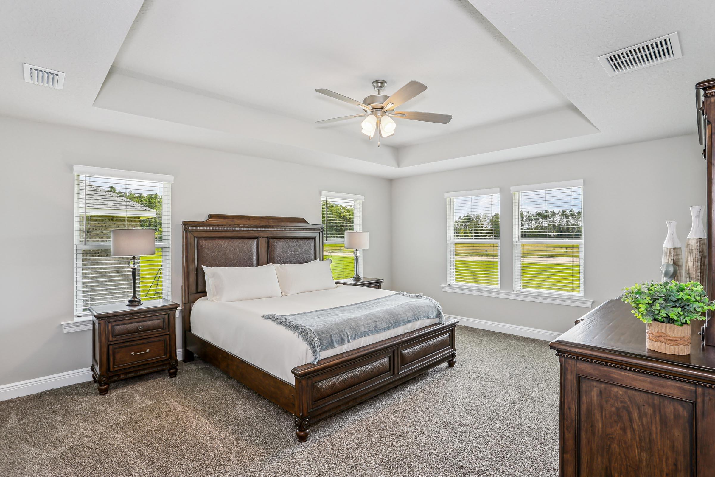 4863 Horace Lunsford Road Milton, FL 32570 - Photo 16 of 36 a bed sitting in a bedroom next to a window