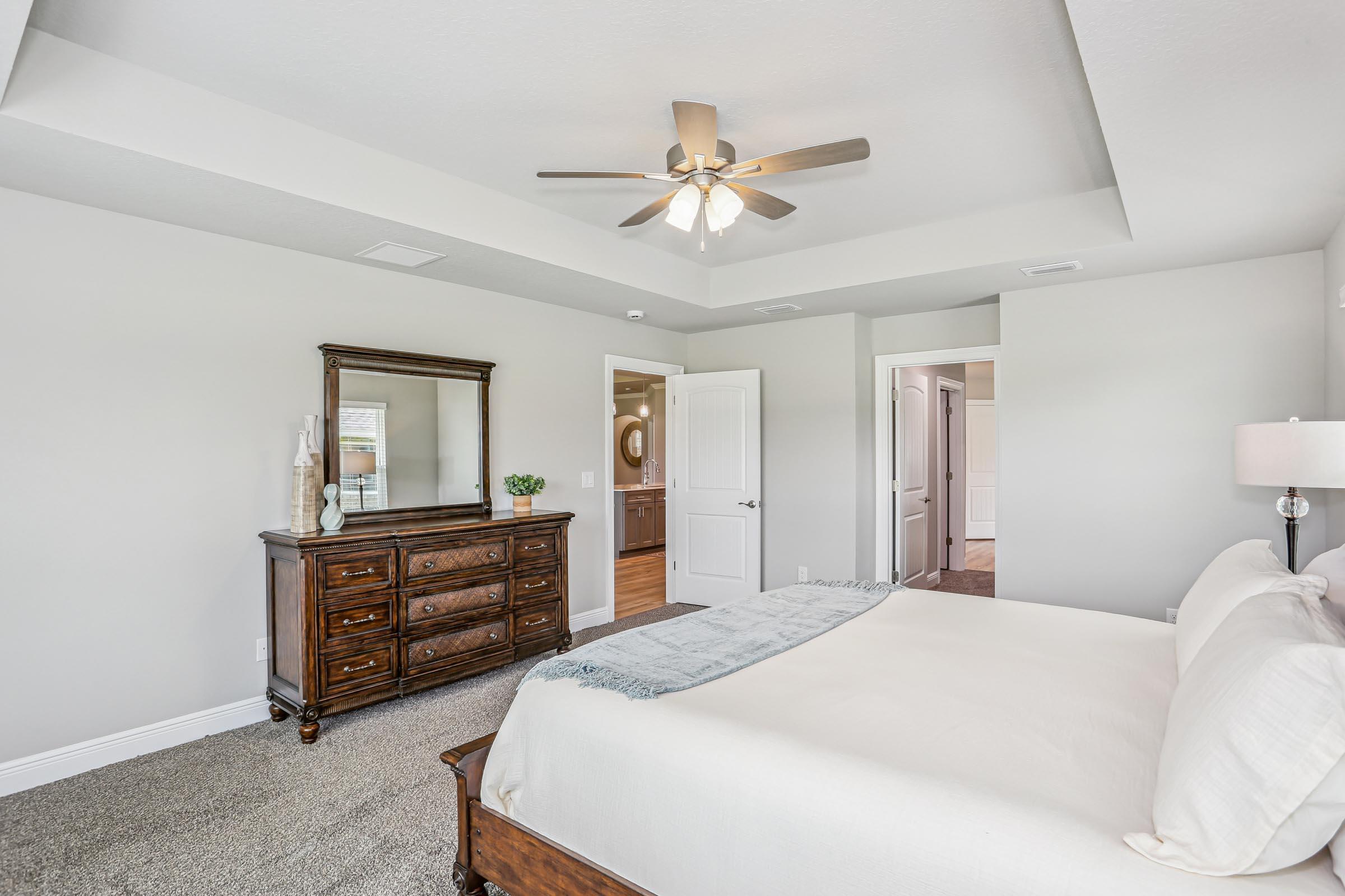 4863 Horace Lunsford Road Milton, FL 32570 - Photo 17 of 36 a bedroom with a bed and a dresser