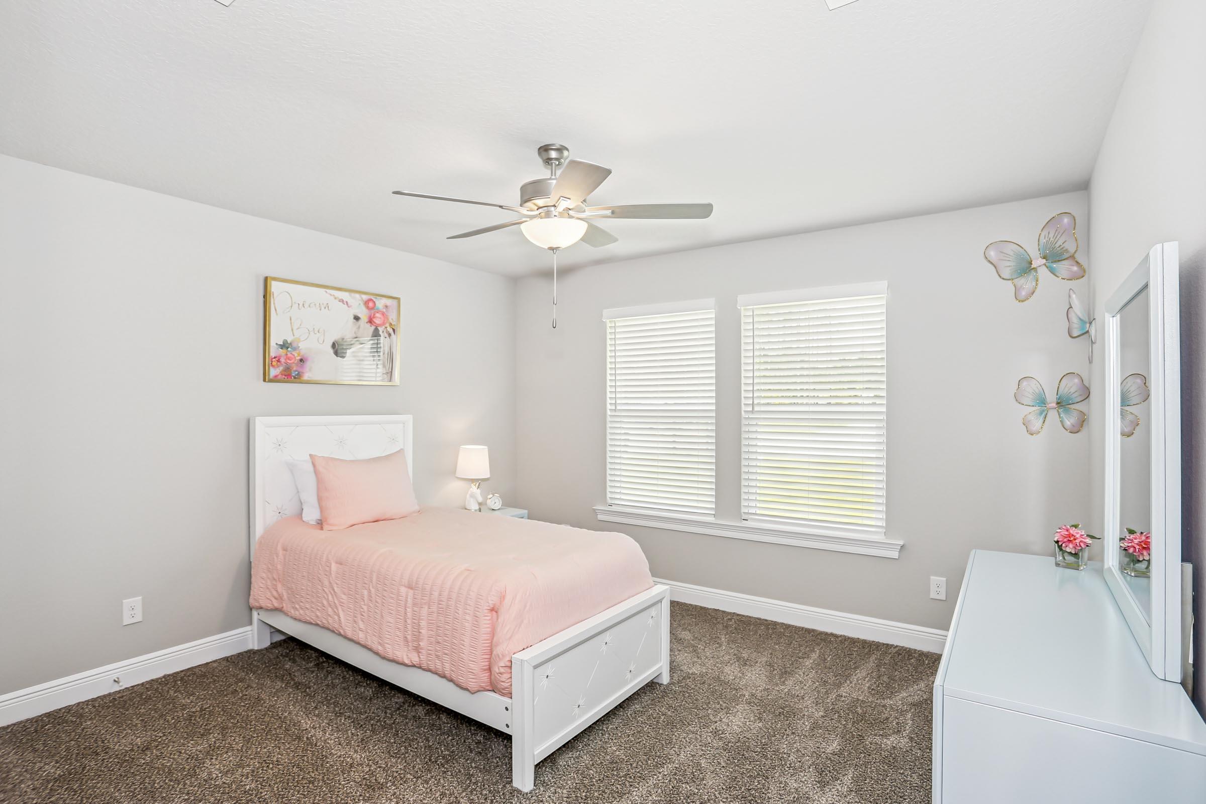 4863 Horace Lunsford Road Milton, FL 32570 - Photo 29 of 36 a bedroom with a bed and a chandelier