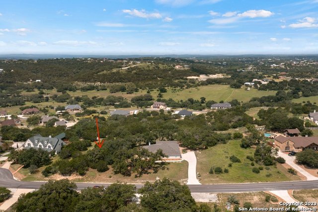 an aerial view of city and lake