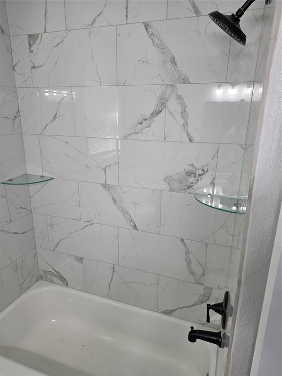 3005 Farrell Lane Fort Worth, TX 76119 - Photo 12 of 16 a bathroom with a bathtub