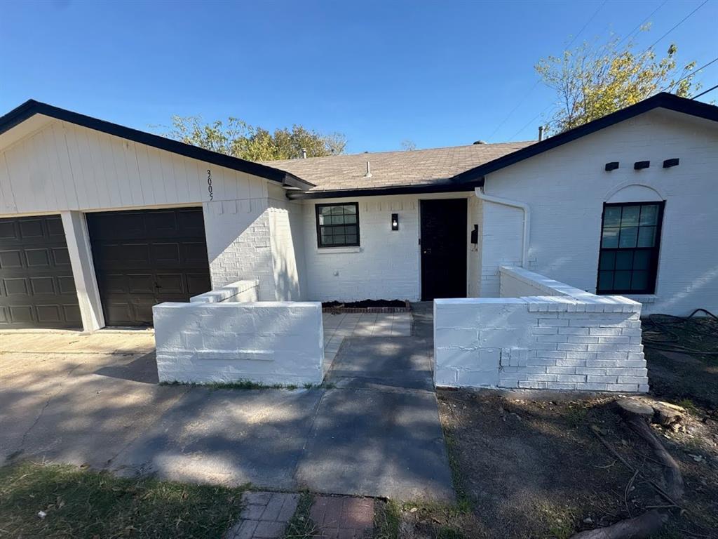 3005 Farrell Lane Fort Worth, TX 76119 - Photo 2 of 16 a view of a white house with a small yard and a large window