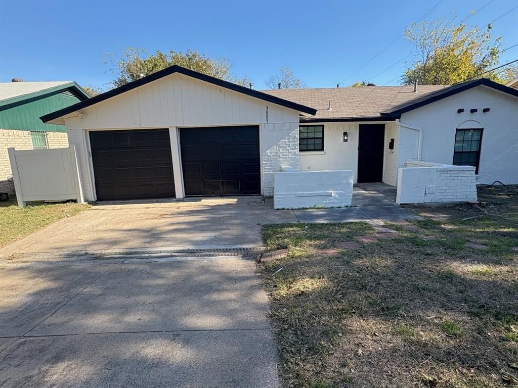 3005 Farrell Lane Fort Worth, TX 76119 - Photo 3 of 16 a front view of a house with a yard