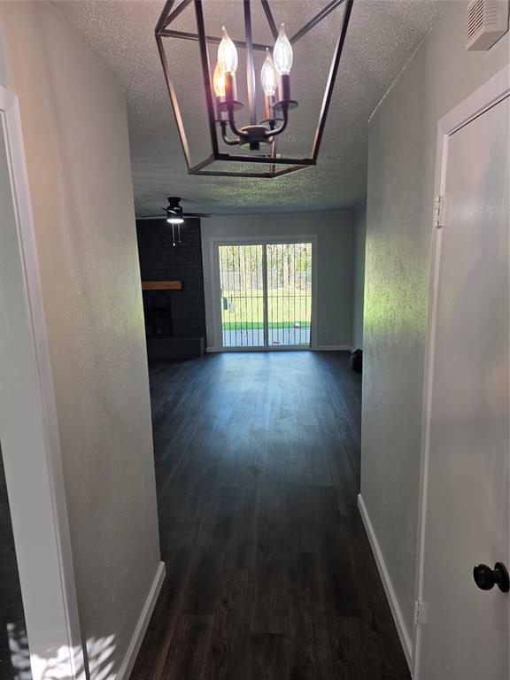 3005 Farrell Lane Fort Worth, TX 76119 - Photo 4 of 16 a view of hallway with stairs and wooden floor