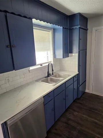 a bathroom with a sink double vanity and a mirror