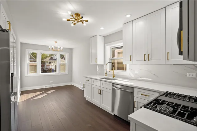 a kitchen with a sink stove and cabinets