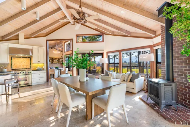 a dining room with furniture window and outside view
