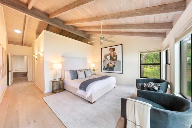 a living room with a couch next to a large window