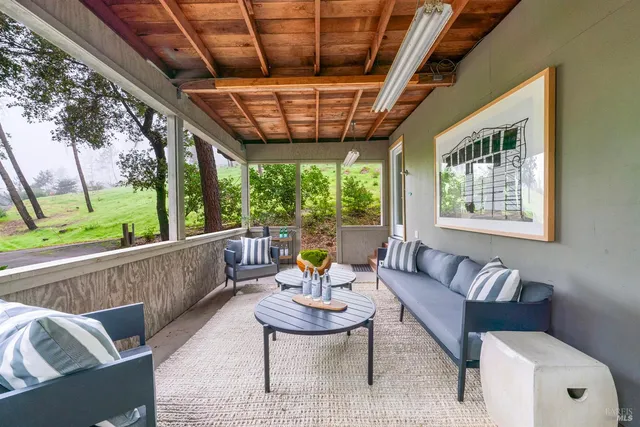 a outdoor living space with furniture and garden view