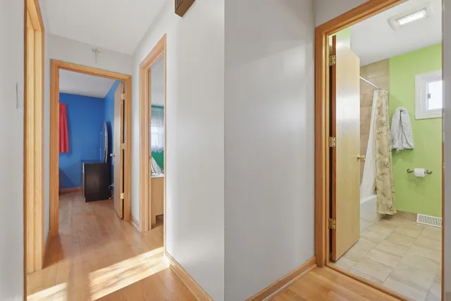 a view of a bathroom from a hallway