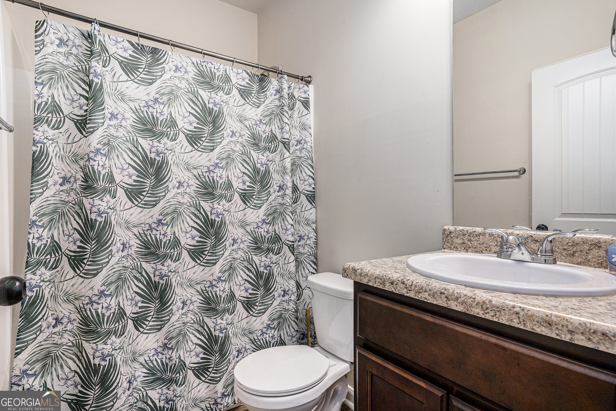 121 Amelia Way Ellenwood, GA 30294 - Photo 16 of 31 a bathroom with a granite countertop sink and a toilet