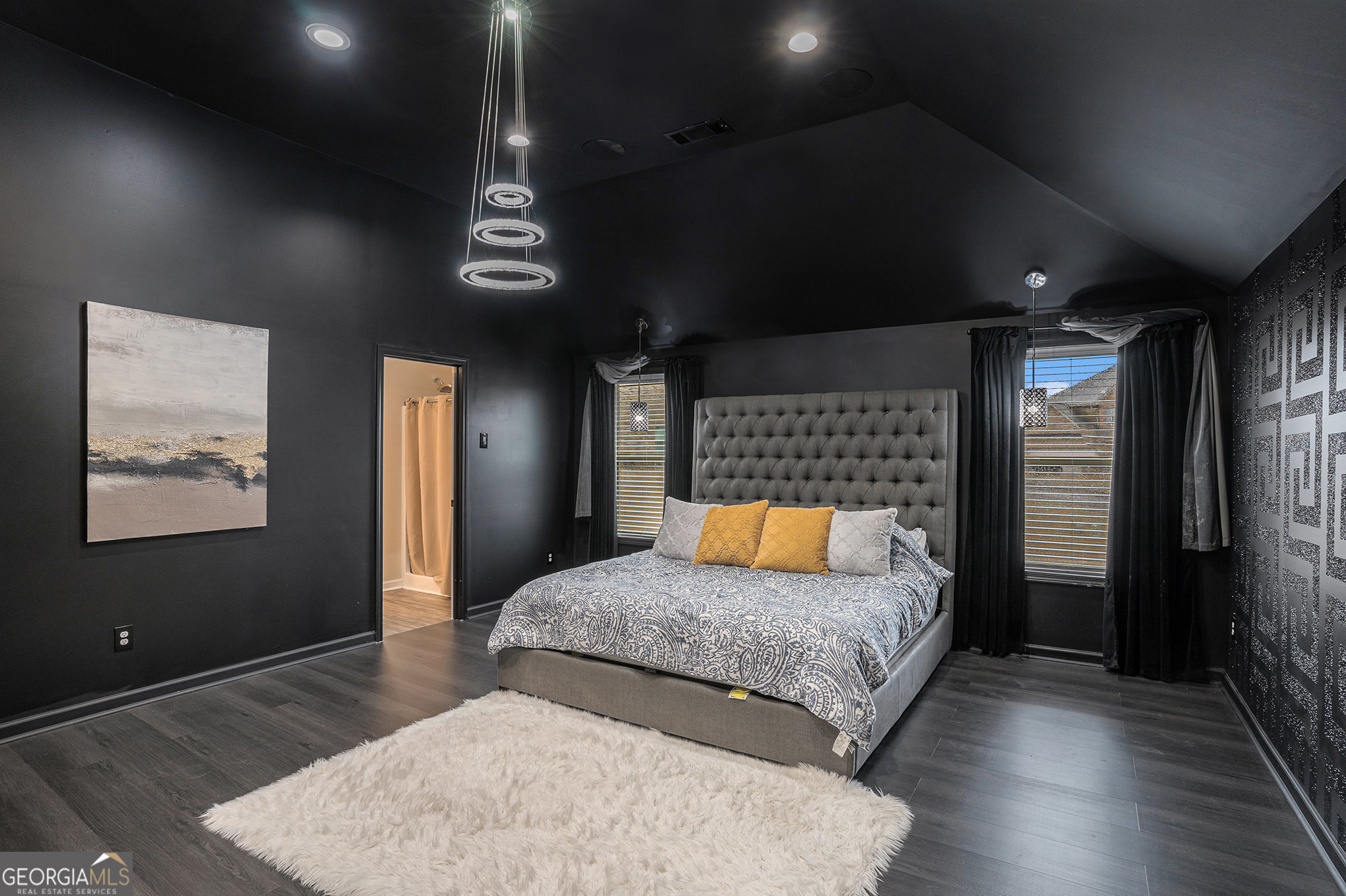 121 Amelia Way Ellenwood, GA 30294 - Photo 19 of 31 a bedroom with a bed and wooden floor