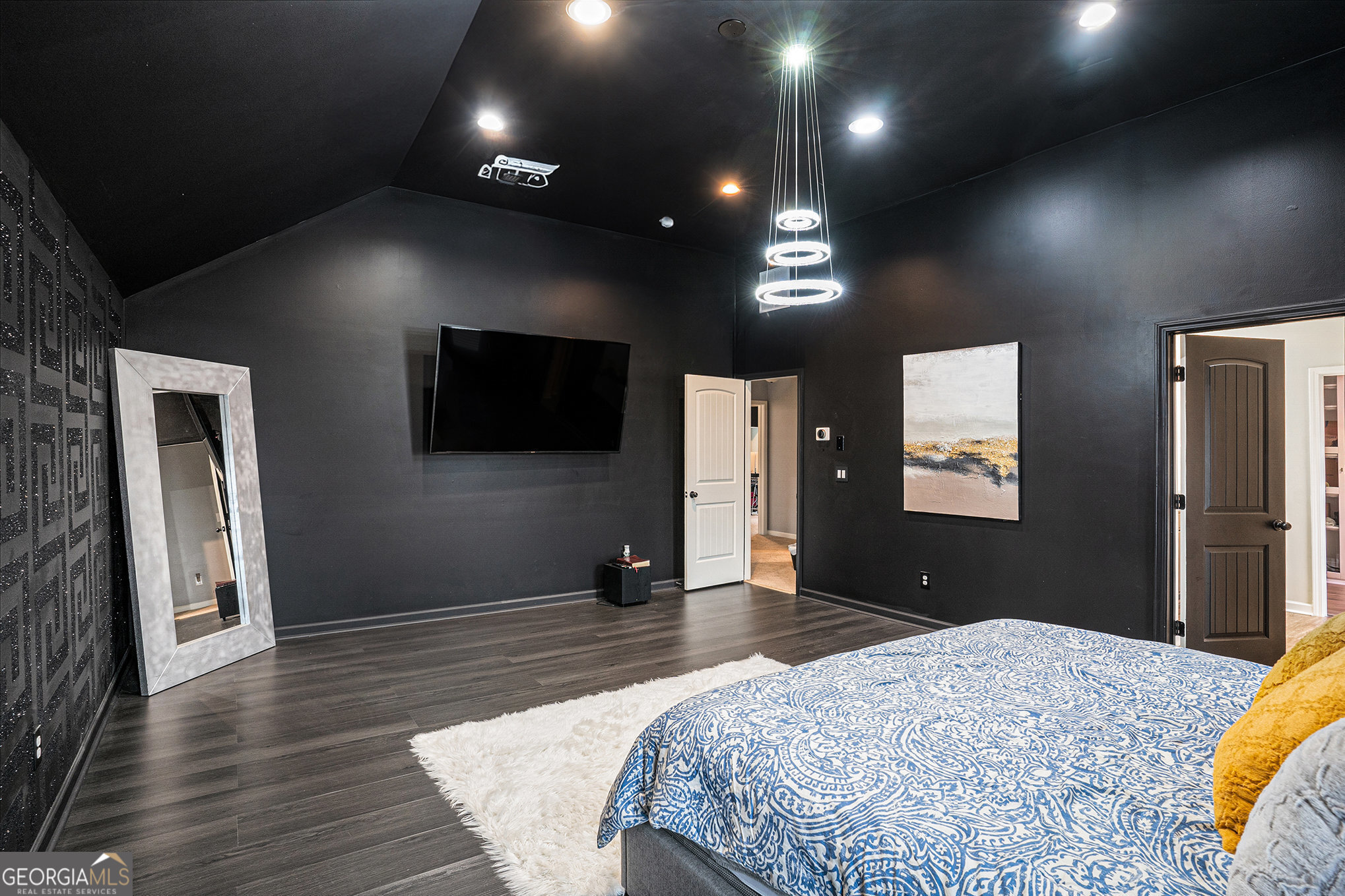 121 Amelia Way Ellenwood, GA 30294 - Photo 20 of 31 a bedroom with a bed and a flat screen tv