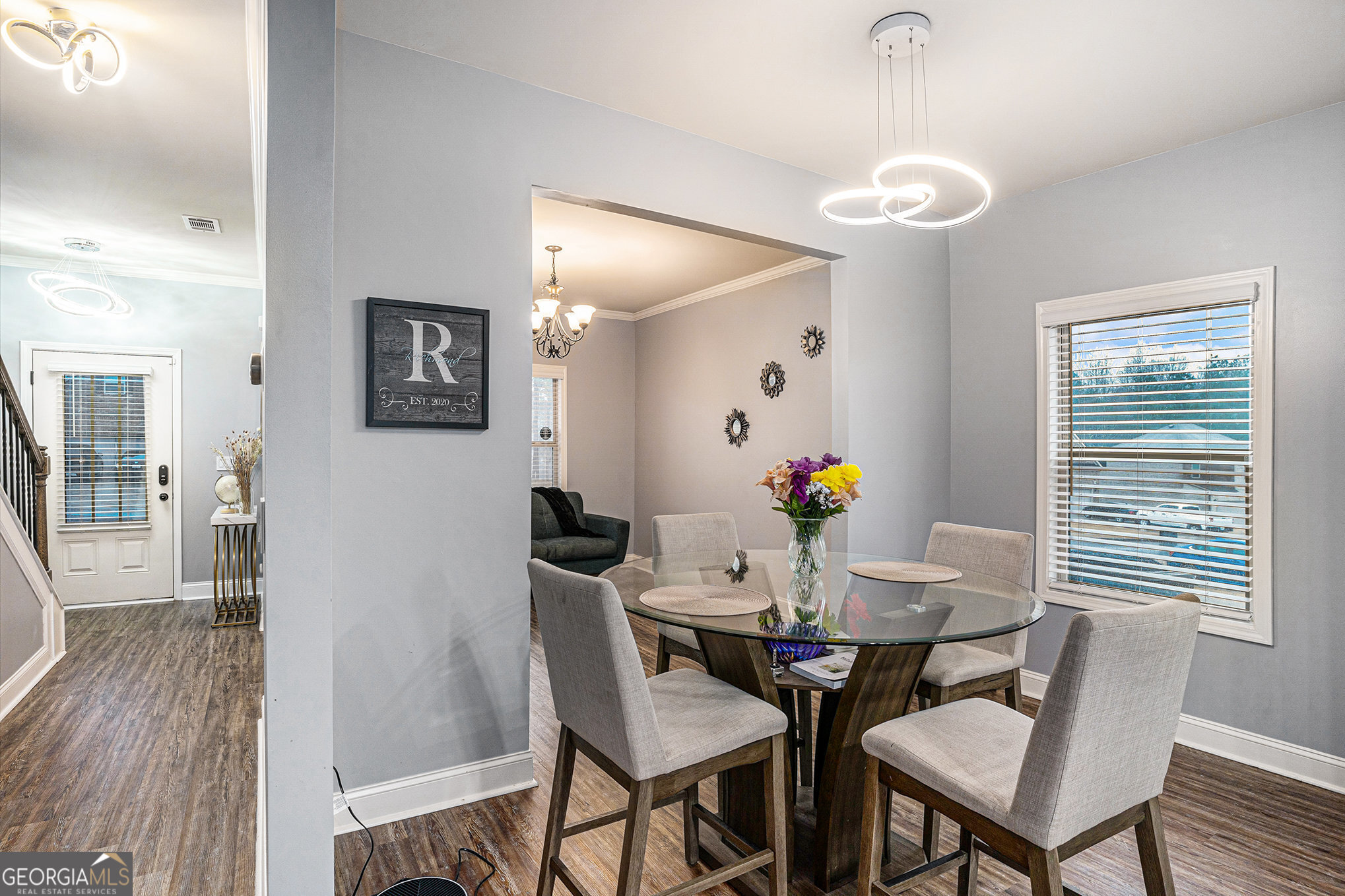 121 Amelia Way Ellenwood, GA 30294 - Photo 9 of 31 a view of a dining room with furniture wooden floor and chandelier