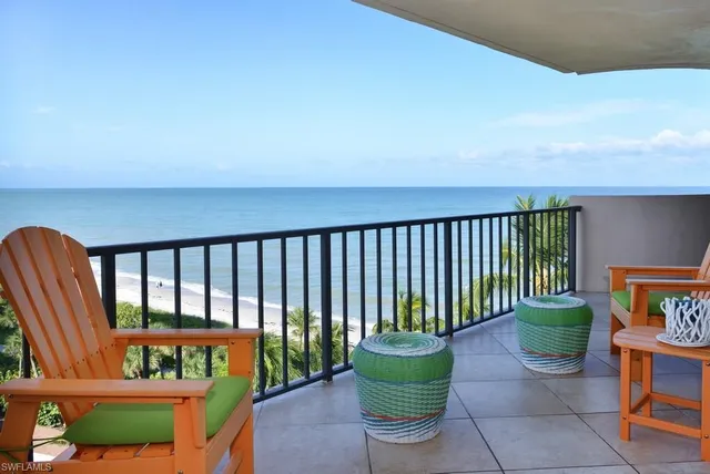 a balcony with chairs