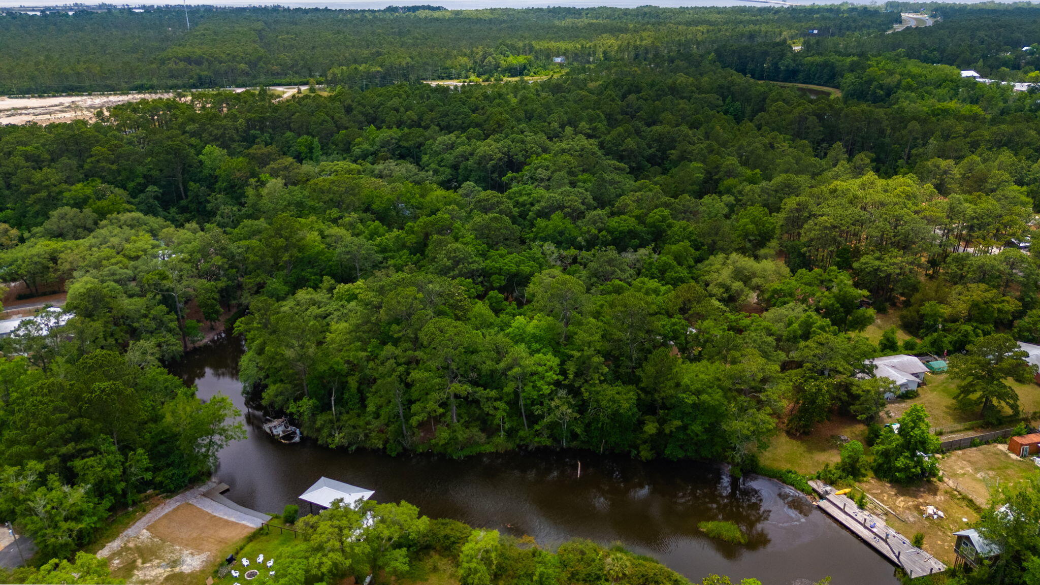 19494 Highway 331 Freeport, FL 32439 - Photo 11 of 36 an aerial view of residential house with outdoor space and trees all around