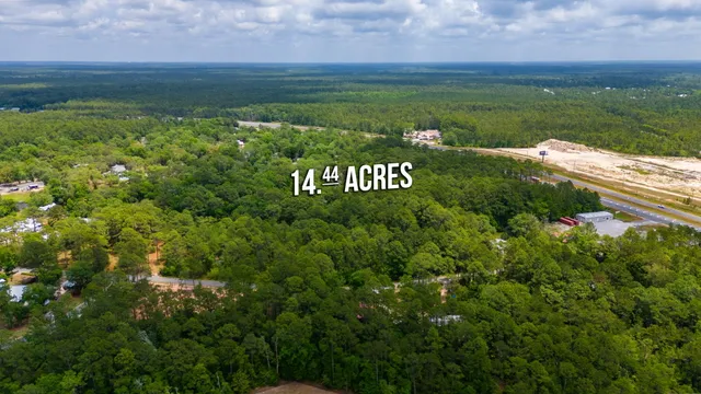 a view of a field with an ocean