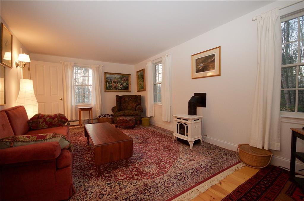 2417 Sennebec Road Appleton, ME 04862 - Photo 8 of 29 Private family room with cast iron...