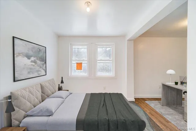 a bedroom with a bed and couch