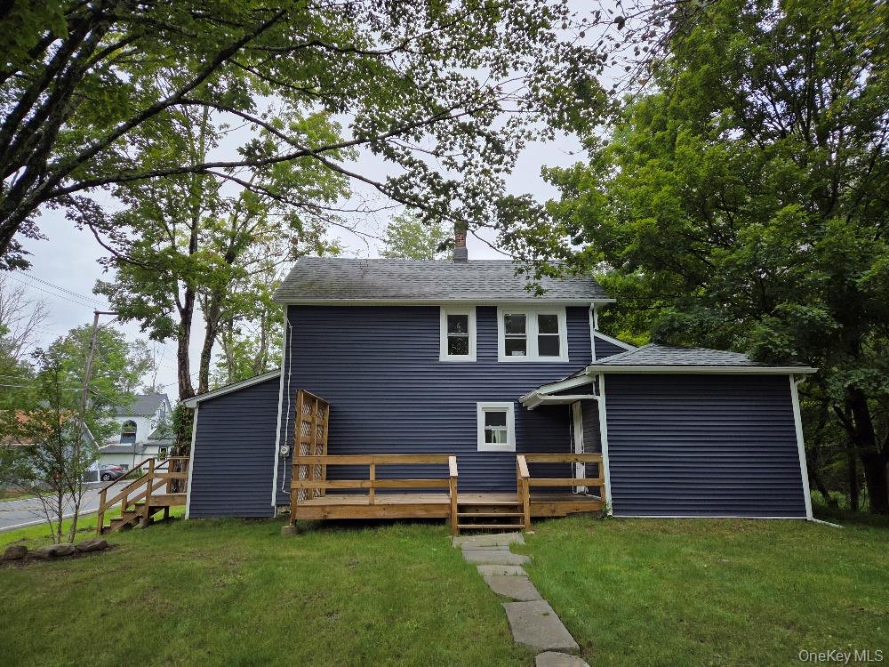 11 Spring Glen Road Mountain Dale, NY 12763 - Photo 3 of 26 a front view of a house with a garden