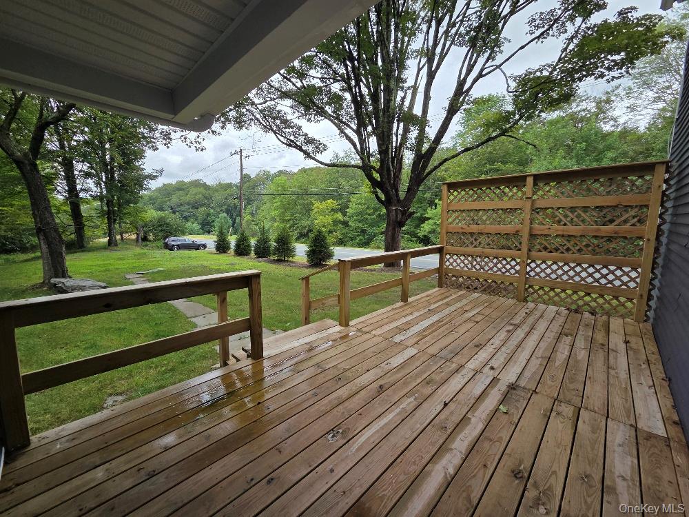 11 Spring Glen Road Mountain Dale, NY 12763 - Photo 4 of 26 a view of a wooden deck with a yard