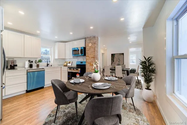 a kitchen with a table and chairs in it