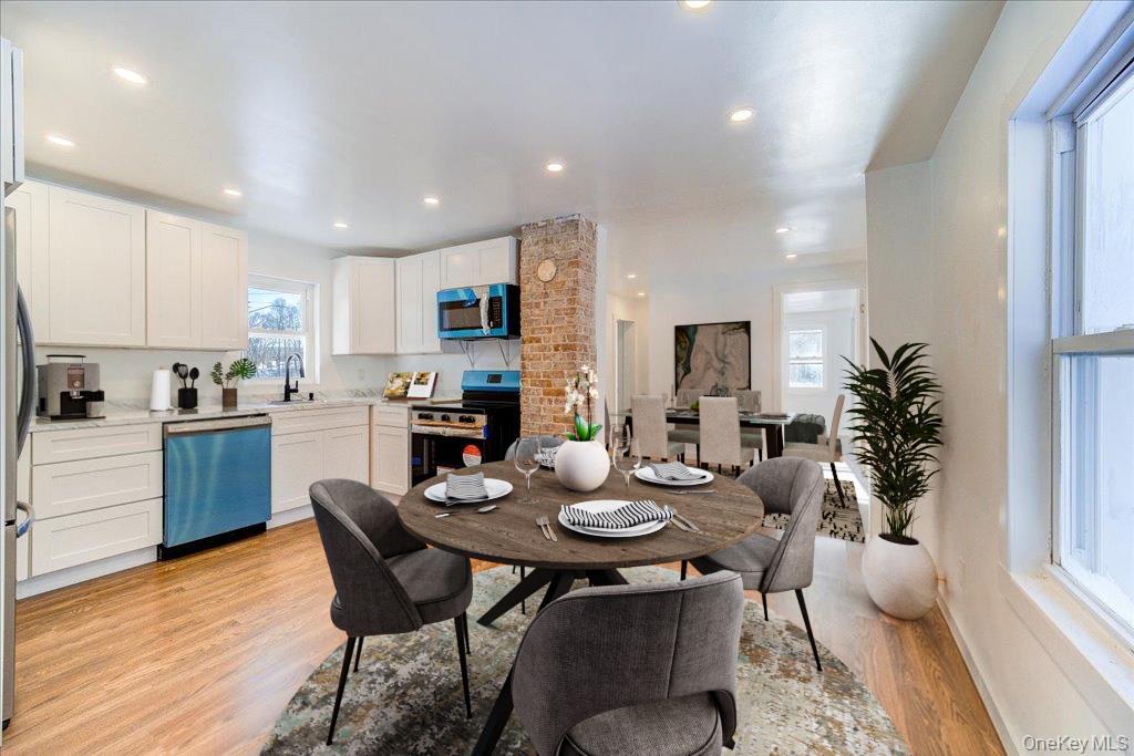11 Spring Glen Road Mountain Dale, NY 12763 - Photo 7 of 26 a kitchen with a table and chairs in it