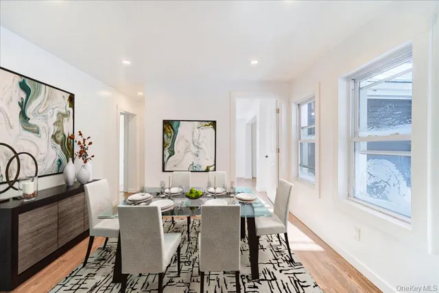 a view of a dining room with furniture window and wooden floor