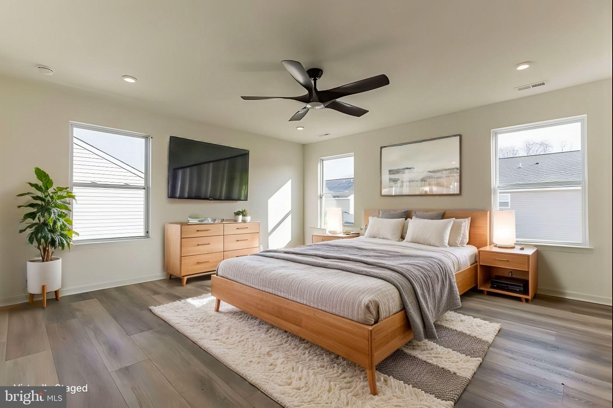 3050 A Tuckahoe Road Franklinville, NJ 08322 - Photo 25 of 27 a spacious bedroom with a bed and a flat screen tv