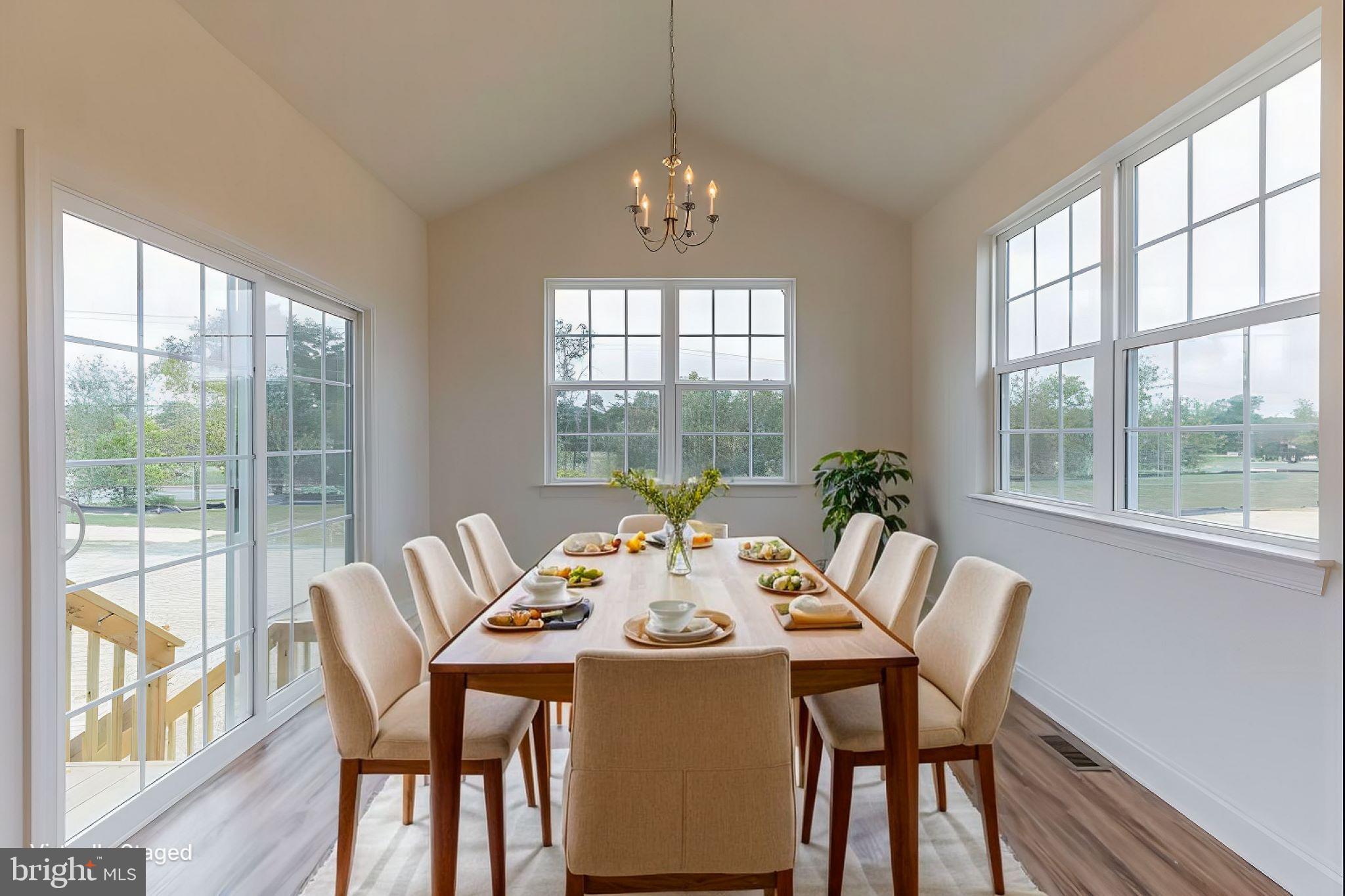 3050 A Tuckahoe Road Franklinville, NJ 08322 - Photo 27 of 27 a dining room with furniture large windows and wooden floor