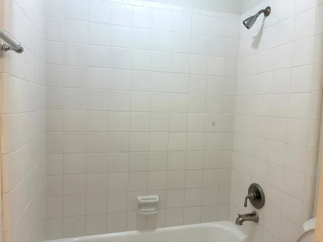 wooden floor in an empty room with a fireplace