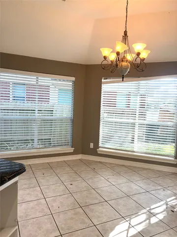 a kitchen with a sink and a stove top oven