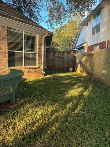 a front view of a house with plants