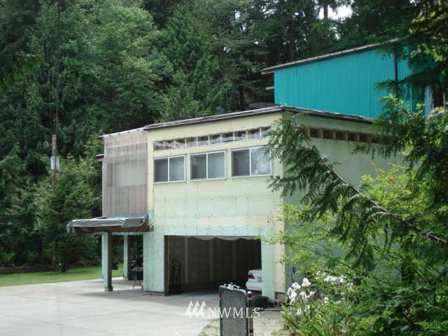 128 224th Street Southeast Bothell, WA 98021 - Photo 1 of 1 a front view of a house with a garden