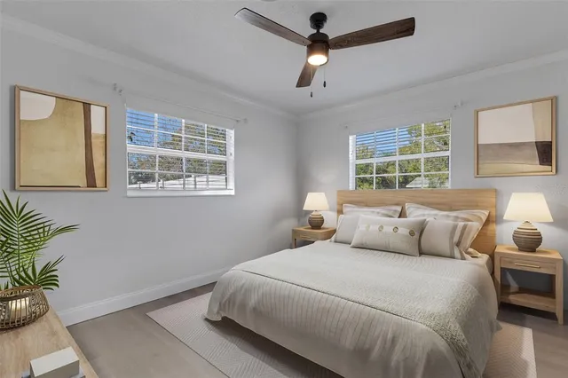 a bedroom with bed and a window