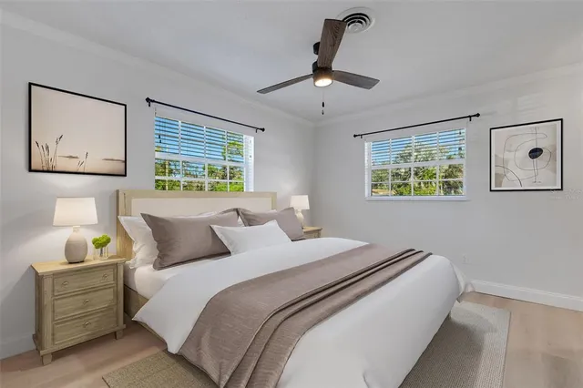 a bedroom with bed and window