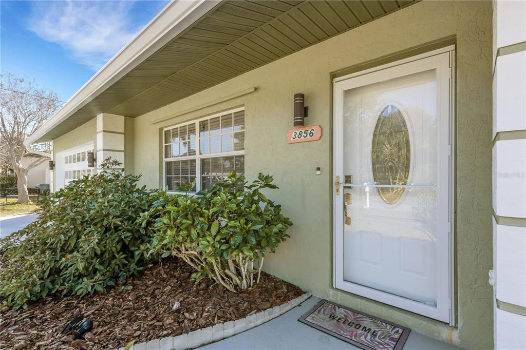 3856 Tarpon Road Venice, FL 34293 - Photo 3 of 53 a front view of a house with garden