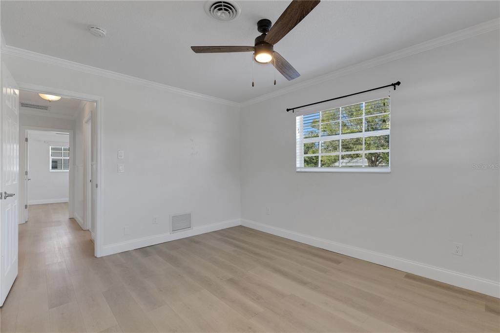 3856 Tarpon Road Venice, FL 34293 - Photo 32 of 53 wooden floor in an empty room with a window