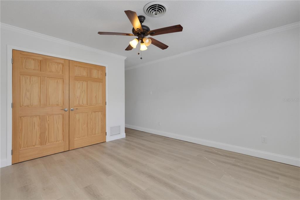 3856 Tarpon Road Venice, FL 34293 - Photo 36 of 53 an empty room with closet and windows