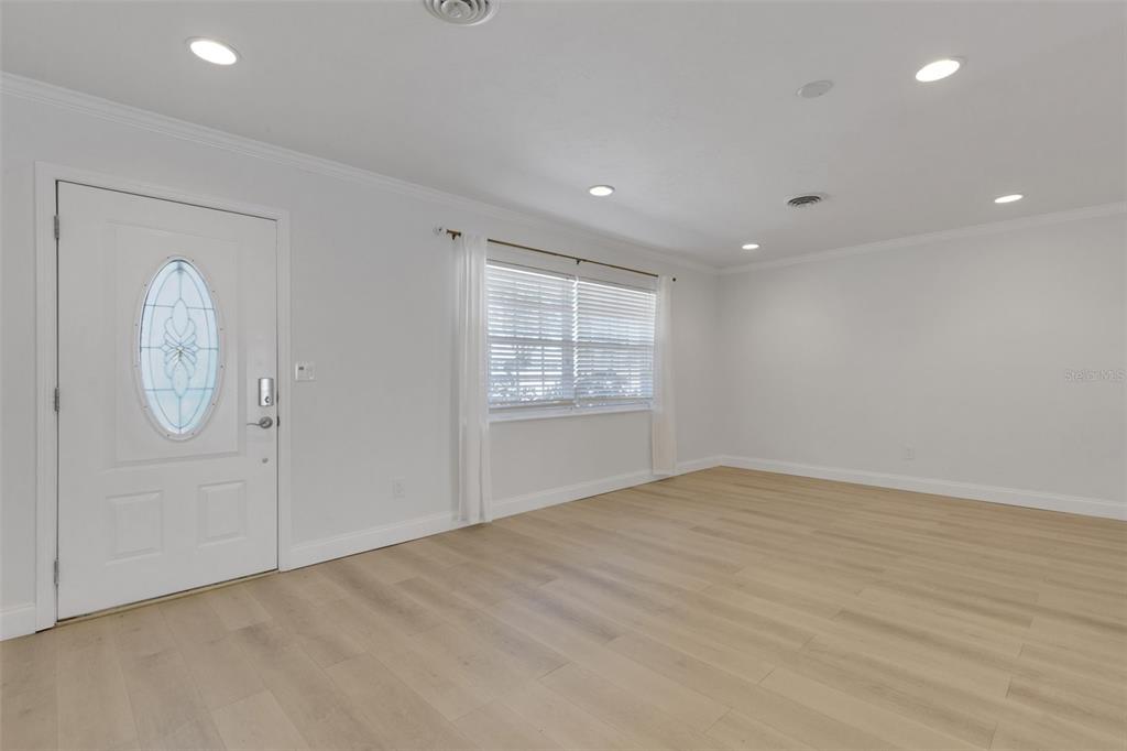 3856 Tarpon Road Venice, FL 34293 - Photo 6 of 53 an empty room with windows