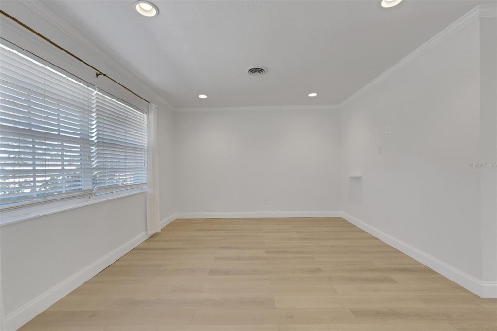 3856 Tarpon Road Venice, FL 34293 - Photo 8 of 53 a view of an empty room with a window