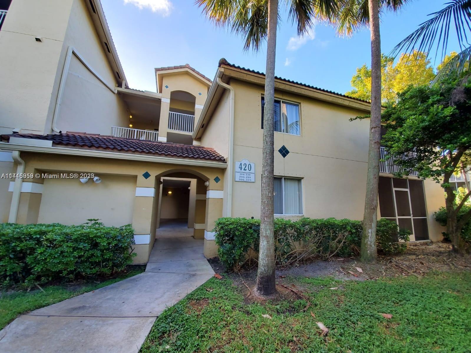 420 South Park Road, Unit 2110 Hollywood, FL 33021 - Photo 4 of 15 a front view of a house with a garden