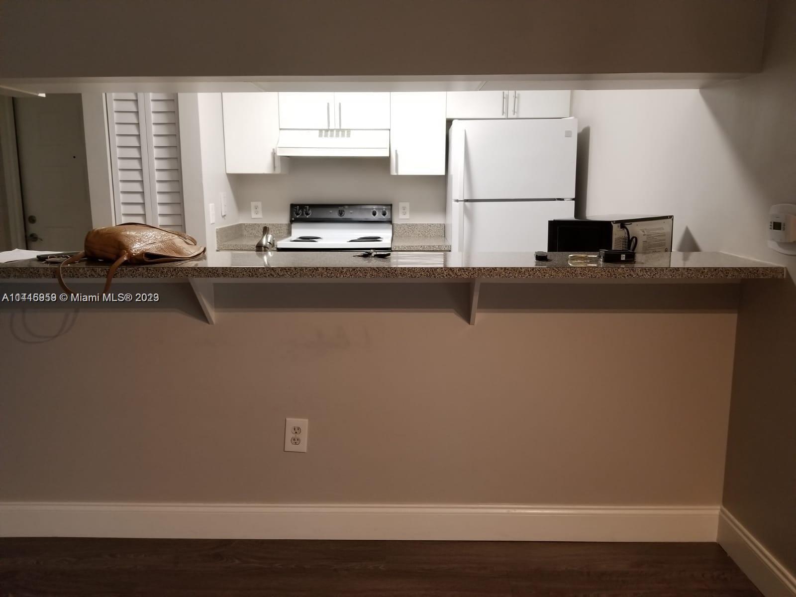 420 South Park Road, Unit 2110 Hollywood, FL 33021 - Photo 5 of 15 a view of workspace with wooden floor