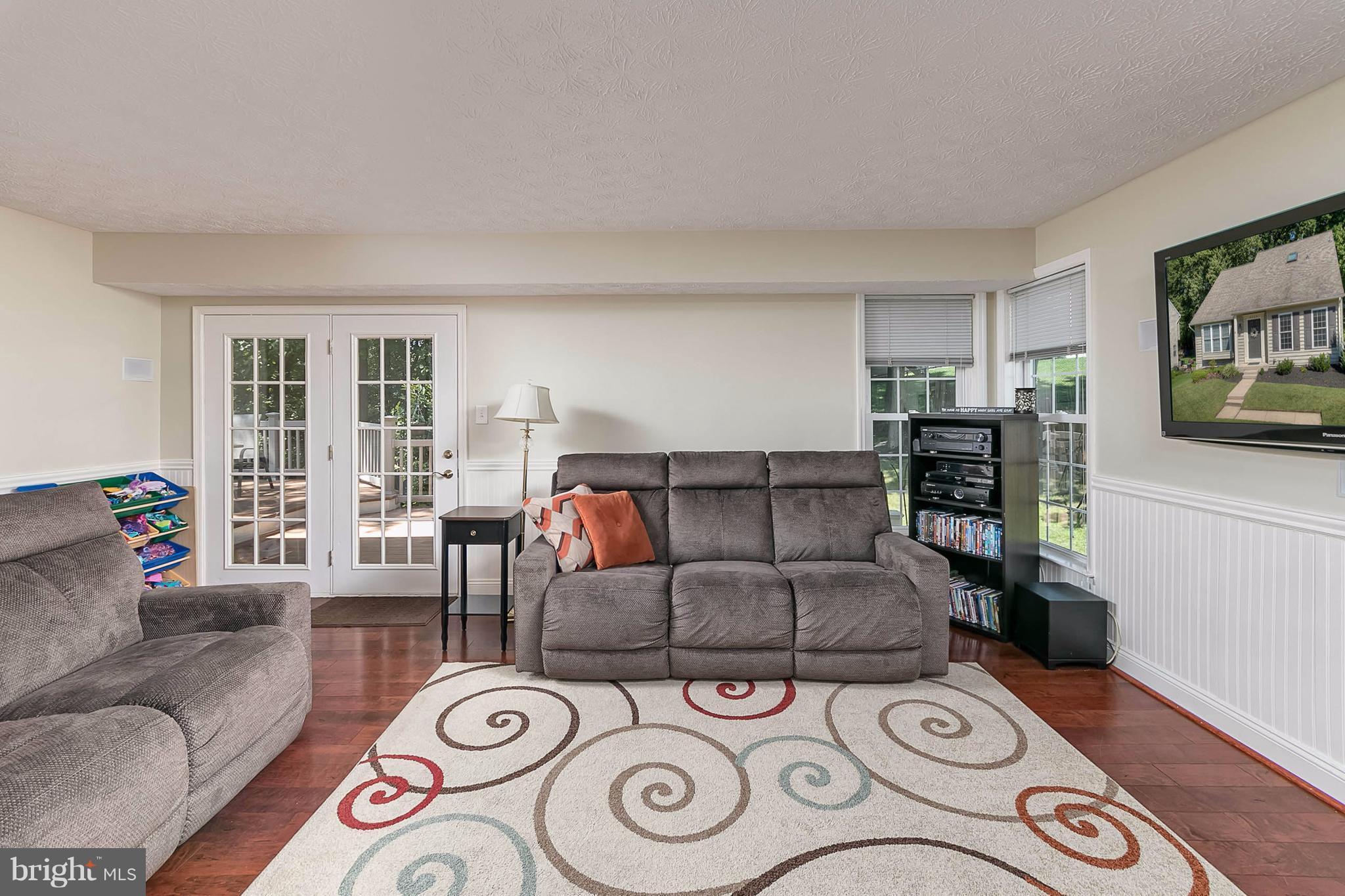 4608 Vicky Road Baltimore, MD 21236 - Photo 13 of 30 a living room with furniture and a flat screen tv