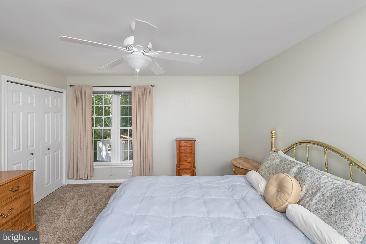 4608 Vicky Road Baltimore, MD 21236 - Photo 16 of 30 a bedroom with a large bed and a window