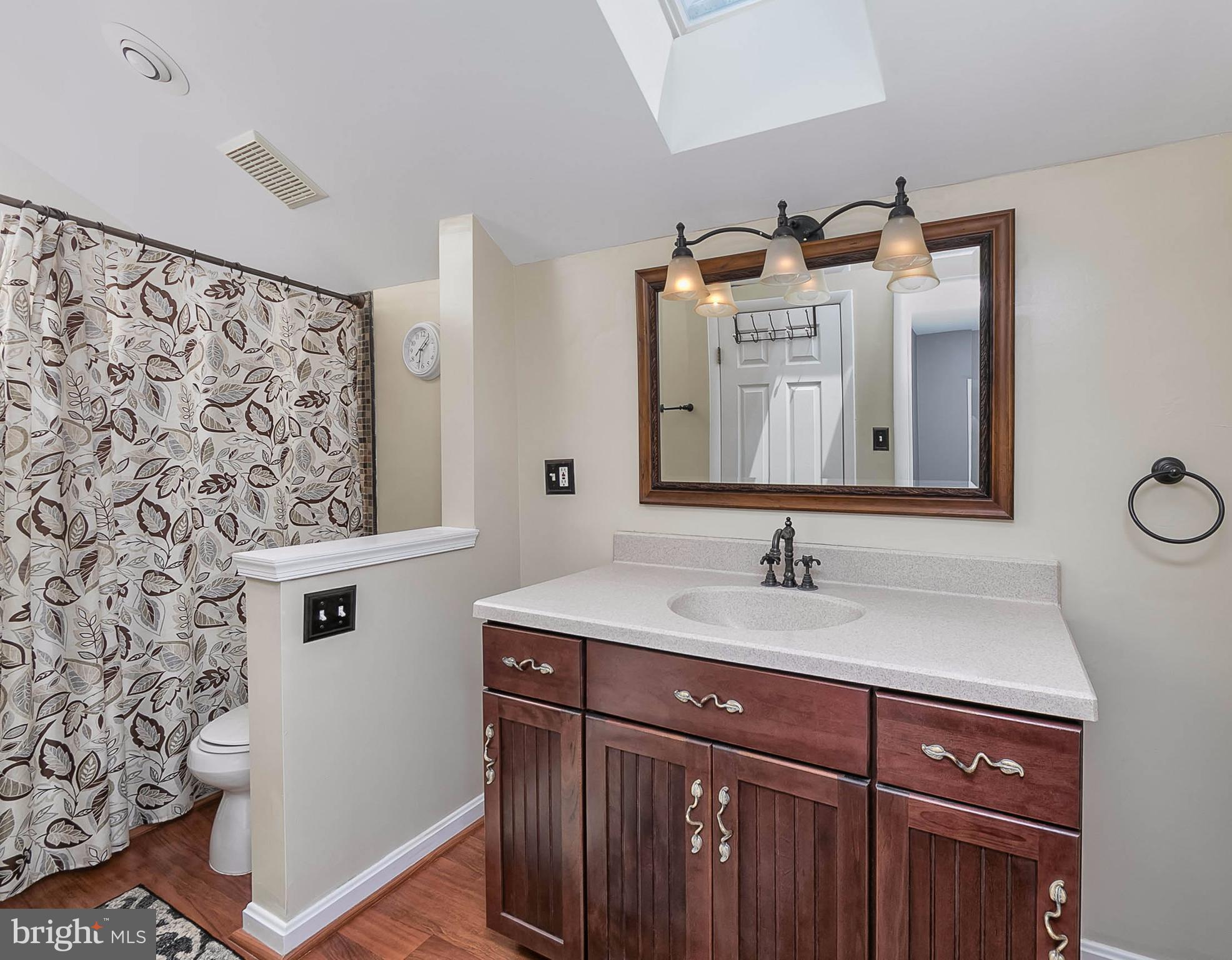 4608 Vicky Road Baltimore, MD 21236 - Photo 18 of 30 a bathroom with a sink and a mirror