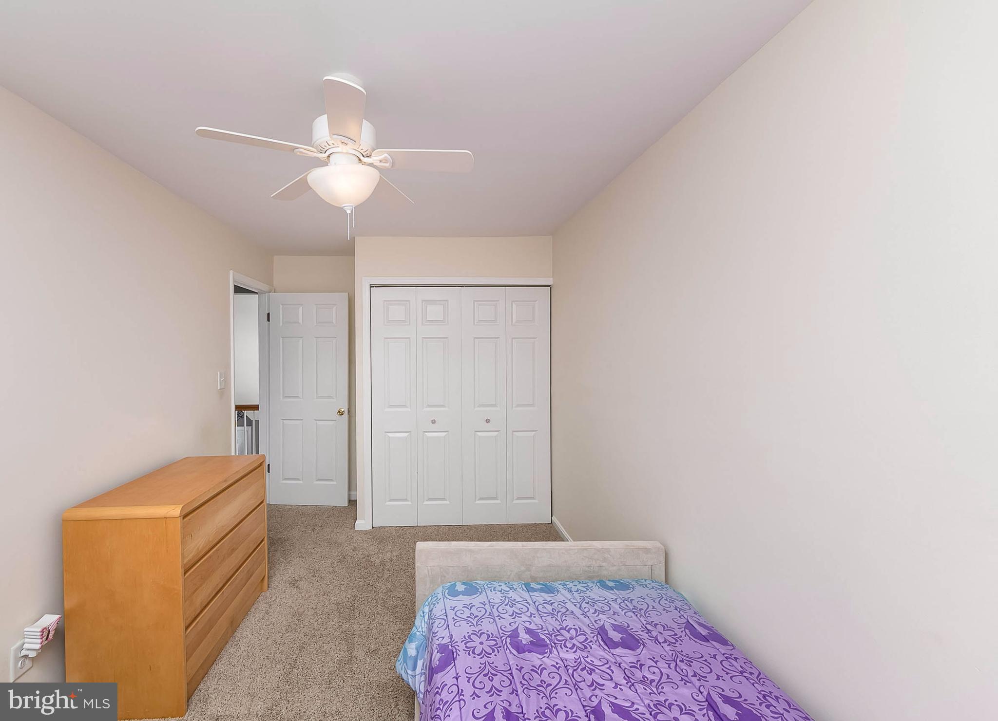 4608 Vicky Road Baltimore, MD 21236 - Photo 21 of 30 a bedroom with a bed and a chandelier