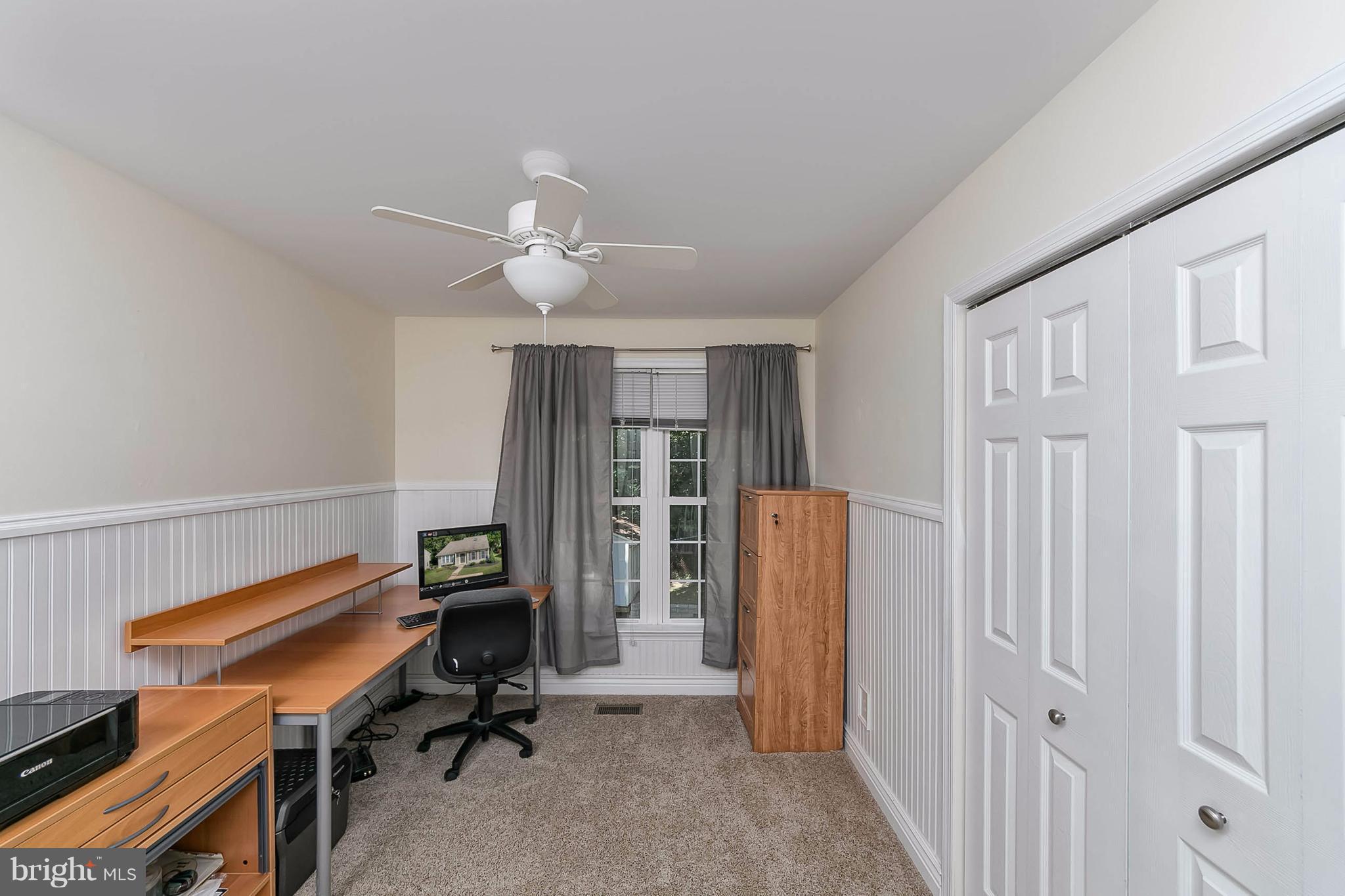 4608 Vicky Road Baltimore, MD 21236 - Photo 22 of 30 a view of a workspace with furniture and a window